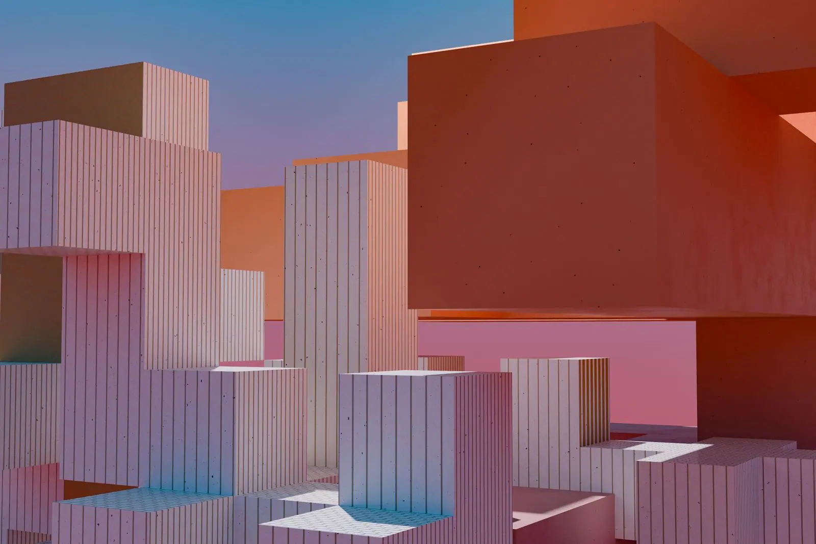 Stacked geometric blocks glowing orange and pink at sunset